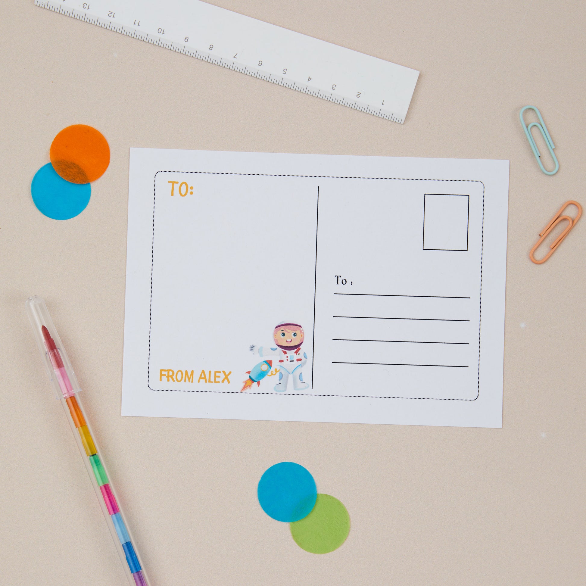 The Back of the Astronaut postcard. The back of the postcard has an illustration of an astronaut on the left hand side, and on the right hand side, there is a postcard style area to write the recipients address