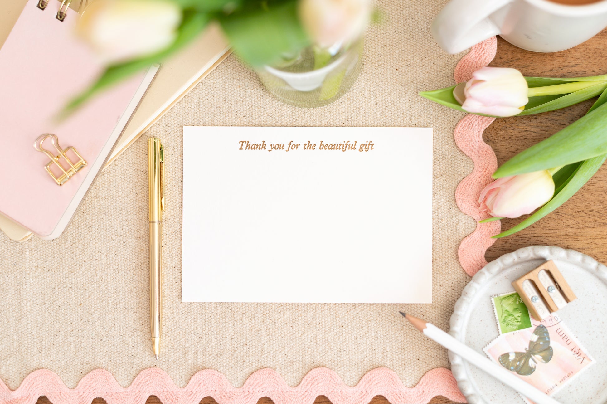 Letterpress A6 Flat Notelet Card with 'Thank you for the beautiful gift' on a table with flowers and stationery
